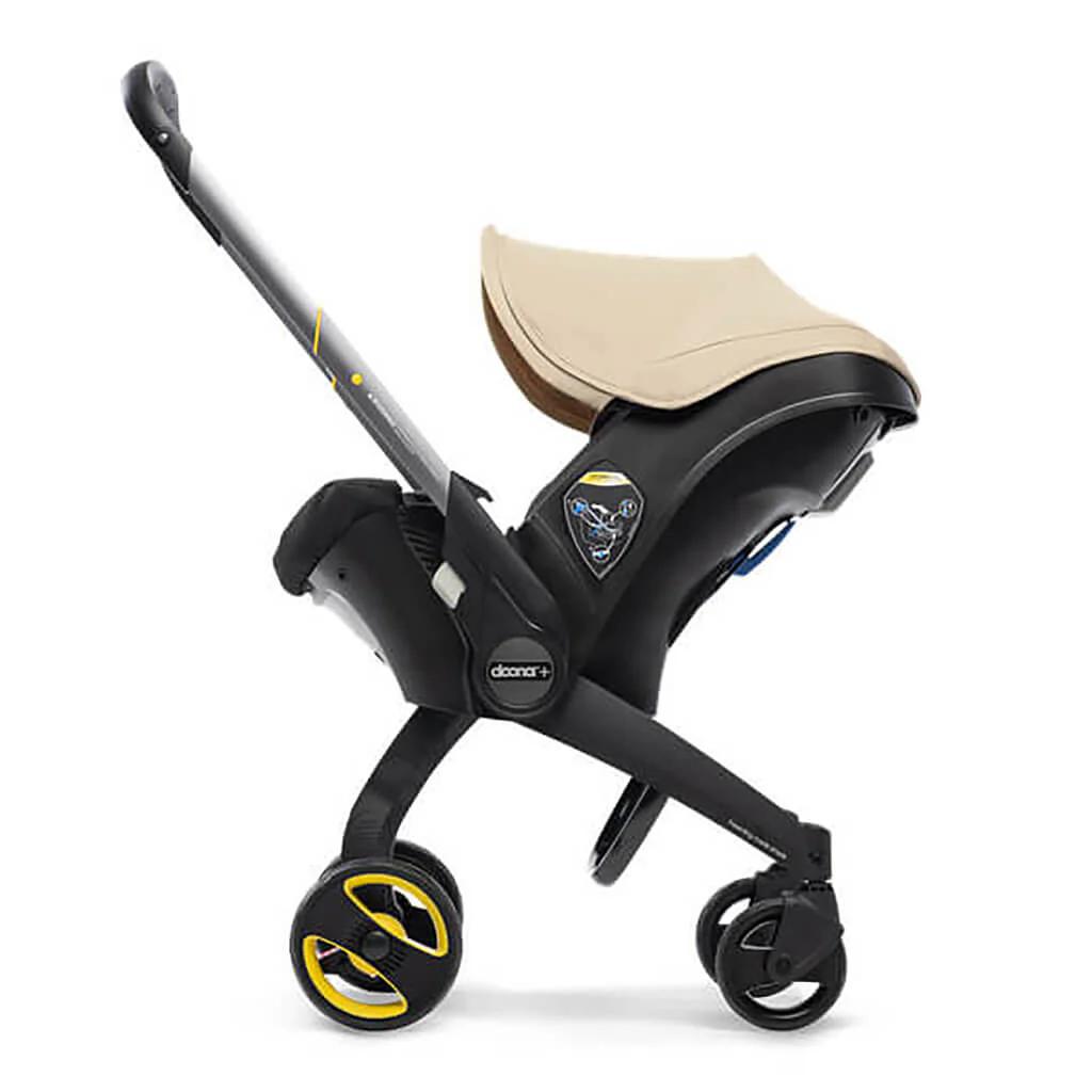 Doona Infant Car Seat & Stroller Travel System - Sahara Sand - Perfect for Travel & Everyday Life